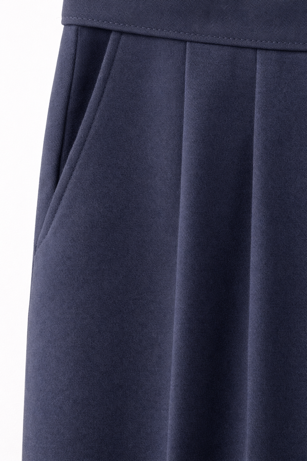 Navy blue pleated skirt on a white background